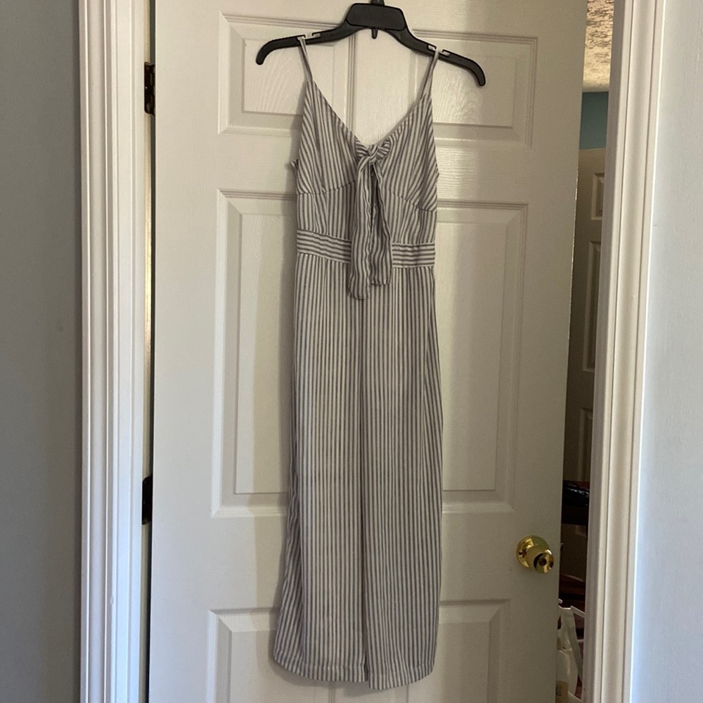 Spaghetti strap jumpsuit. White with blue strips.